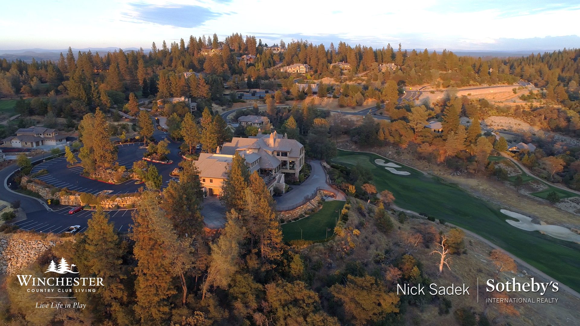 Aerial view of Winchester golf course with homes and water features