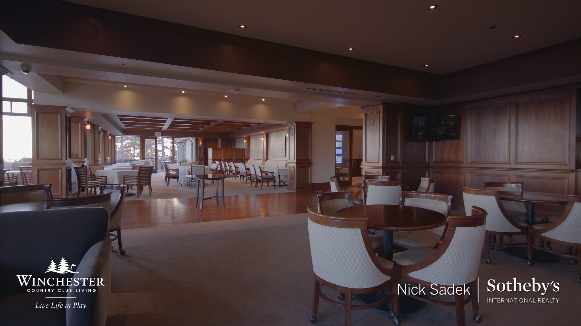 Fine dining room with round tables and wood paneling